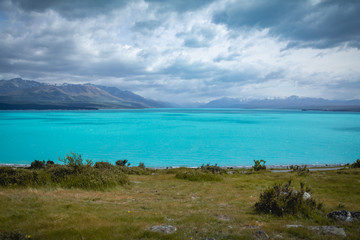 The bright blue teal color of Lake Pukaki in New Zealand