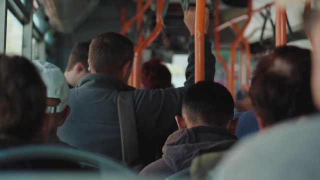 Slow motion shot of people riding the bus. Commuters on public transport
