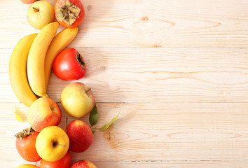 fruits on a white wooden background with place for text