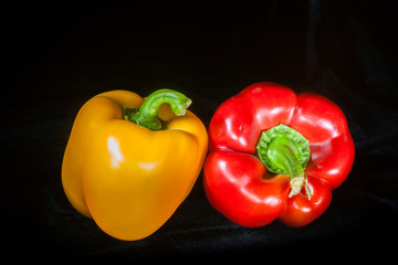 Red and Yellow Peppers on Black