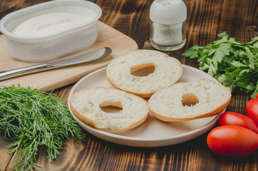 Vegetarian food with round toast, vegetables and cheese on wooden table/Healthy food with round toast, vegetables and cheese on wooden table.