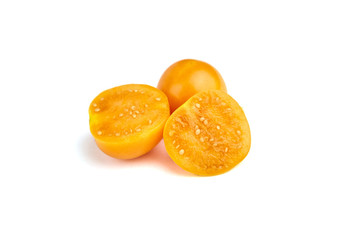 Fototapeta na wymiar Physalis peruviana or groundcherries, whole and halved berries isolated on a white background