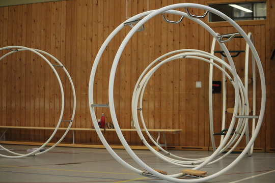 gymnastic apparatus called "Rhoenrad" (German Wheel) inside of a gym