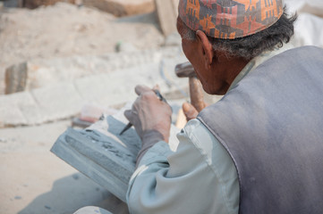 Stone carver working on his craft