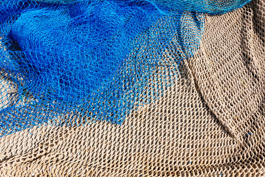 Commercial beige and blue color fishing nets background