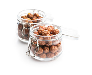 Hazelnuts with sugar icing in jar.