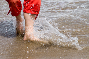 close up men feet in water
