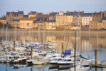 Yachts and houses with it's reflection in the port of Saint Malo, Normandy, France