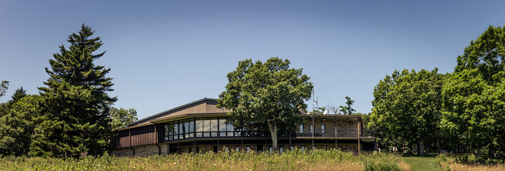 Fototapeta premium Panorama view of tourist centrum building in meadow of shenandoah national park