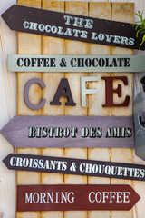 Billboard with signs related to commercial activities. Indications with arrows about breakfast on...