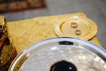 Religious marriage in the Orthodox church. Wedding matrimony. Exchanging wedding rings. 