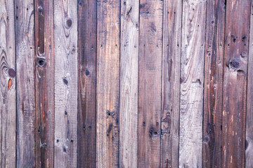 Naklejka premium Old painted wooden fence. Background texture.