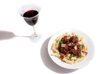 Italian meat balls, with black olives, a tomato sauce, basil, served with parmesan cheese on penne pasta