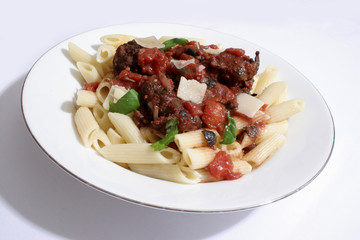 Italian meat balls, with black olives, a tomato sauce, basil, served with parmesan cheese on Penne pasta