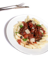 Italian meat balls, with black olives, a tomato sauce, basil, served with parmesan cheese on Penne pasta