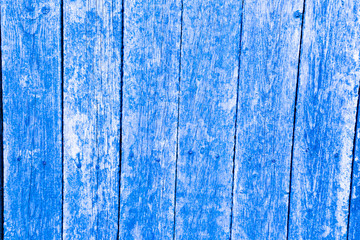 Fototapeta na wymiar Old painted wooden fence. Background texture.