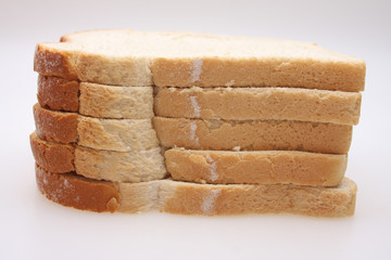 A studio photograph of 5 slices of white bread