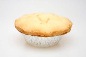 A British mince pie photographed against a white background
