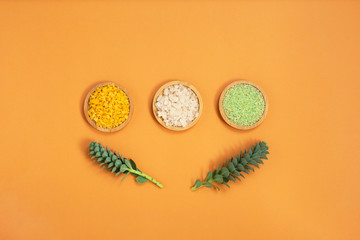 Different Sea salt on wooden tray. Beauty, bath and wellness concept