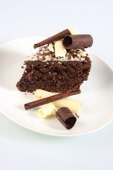 A slice of a chocolate sponge cake