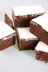 A studio photograph of chocolate brownies