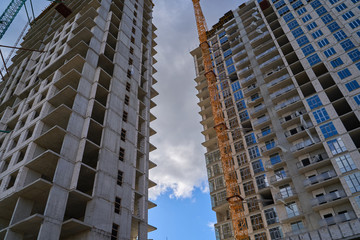 Construction site. High rise Building under construction. Construction of high-rise residential building
