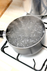 A pan of boiling water on a hob