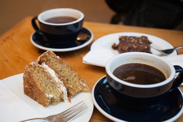 Coffee and Cake on a table in a cafe in the UK