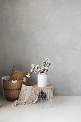 Fototapeta na wymiar Cotton flower arrangement on the grey background