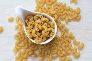 Italian long and short pasta, on white wooden background