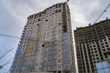 Construction site. High rise Building under construction. Construction of high-rise residential building