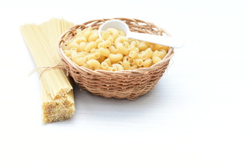 Italian long and short pasta, on white wooden background