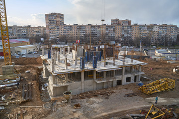 Fototapeta premium Construction site. High rise Building under construction. Construction of high-rise residential building