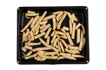 An oven try with oven chips ready to cook