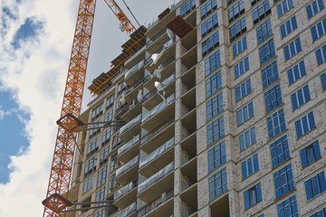 Construction site. High rise Building under construction. Construction of high-rise residential building