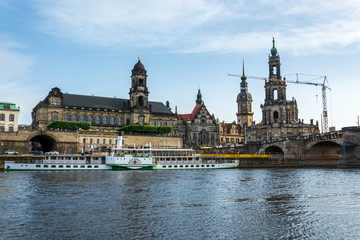 Fototapeta na wymiar The riverside of Dresden with the tower Hausmannsturm and the river Elbe