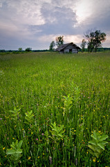An old cabin from another time still stands on the Midwest prairie.