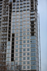 Construction site. High rise Building under construction. Construction of high-rise residential building