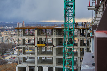 Construction site. High rise Building under construction. Construction of high-rise residential building