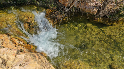 Aerial drone photo of beautiful waterfall of Valanaris in Drafi area near mount Penteli, Attica, Greece