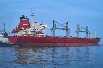 bulk carrier vessel is sailing in the port area.