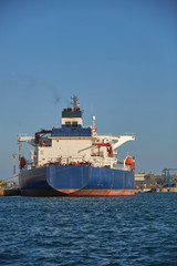 Oil tanker at the port terminal. Tanker in port at oil terminal