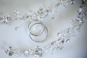 Two white golden wedding rings. Symbol for marriage, love, relationships, proposals, valentine's day