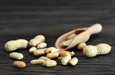 Peanuts on wooden background