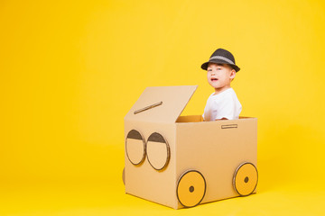 little children boy smile so happy driving car creative by cardboard