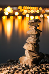 Pile of stones with background blur and lights in the background