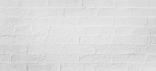 White brick wall background. Neutral texture of a flat brick wall close-up.