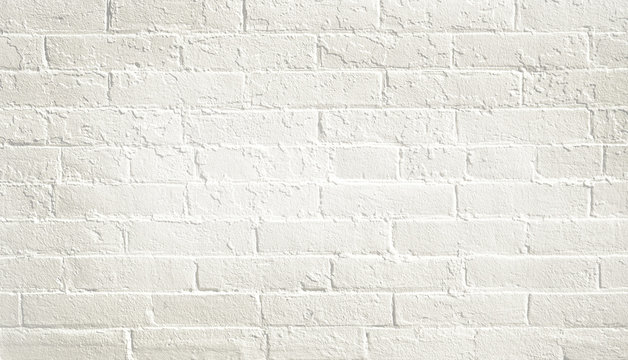 Fototapeta White brick wall background. Neutral texture of a flat brick wall close-up.