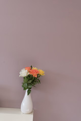 flowers against wall plain colour with negative space for words