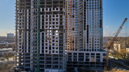 Fototapeta na wymiar Construction of high-rise residential building. Aerial view of construction of high-rise apartment building.